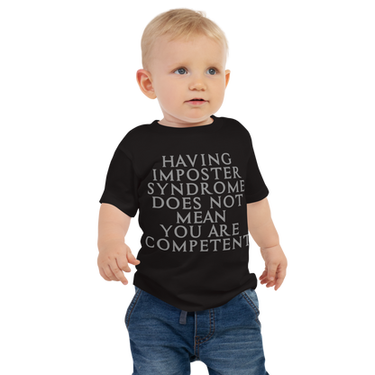 "Having Imposter Syndrome does not mean you are competent" printed on a black baby jersey short sleeve tee worn by a male
