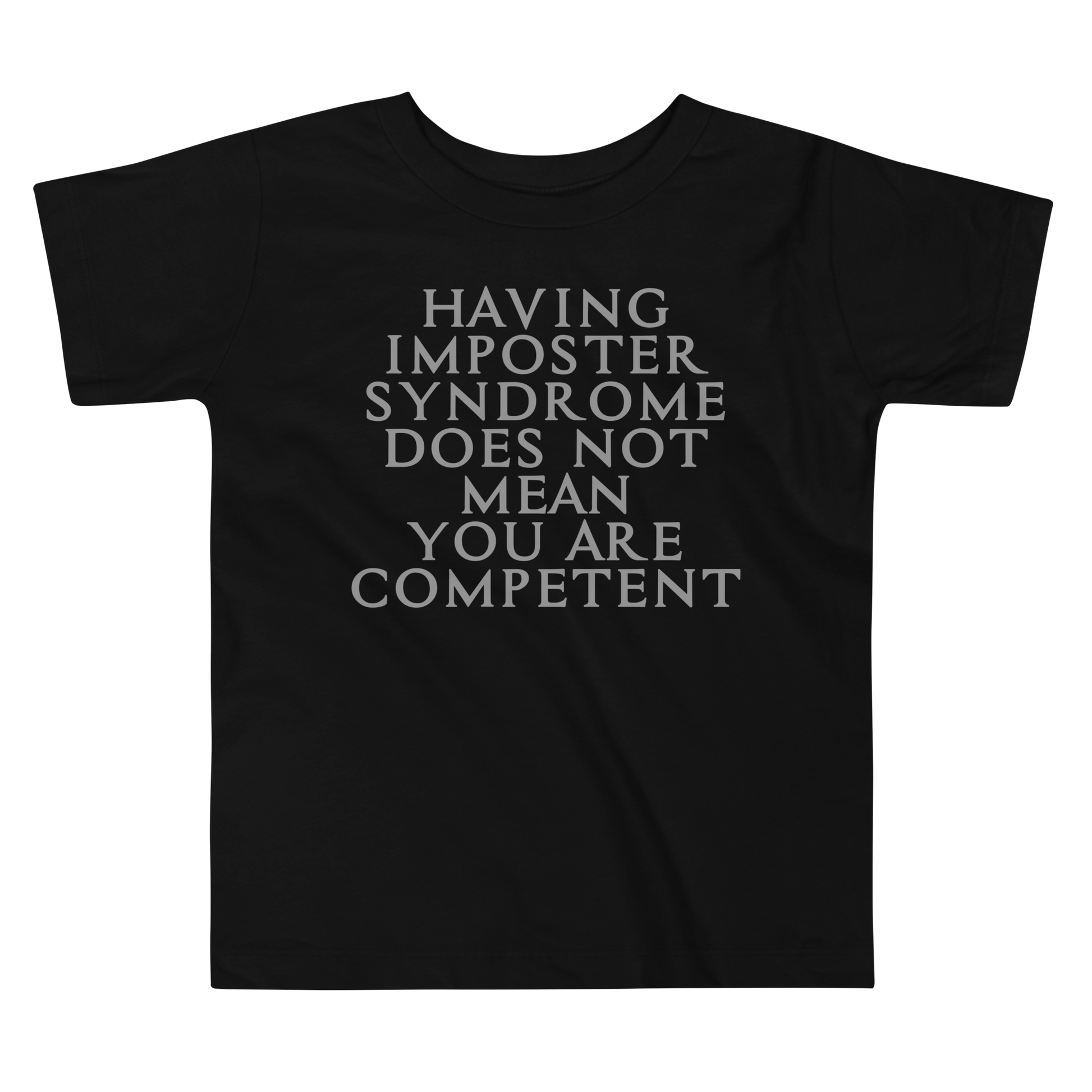 "Having Imposter Syndrome does not mean you are competent" printed on a black toddler short sleeve tee laying on a flat surface