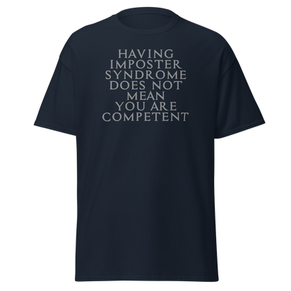 "Having Imposter Syndrome does not mean you are competent" printed on a navy unisex classic tee laying on a flat surface