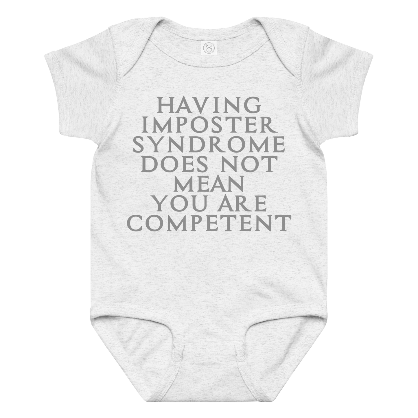 "Having Imposter Syndrome does not mean you are competent" printed on a ash baby jersey bodysuit laying on a flat surface amongst other clothes