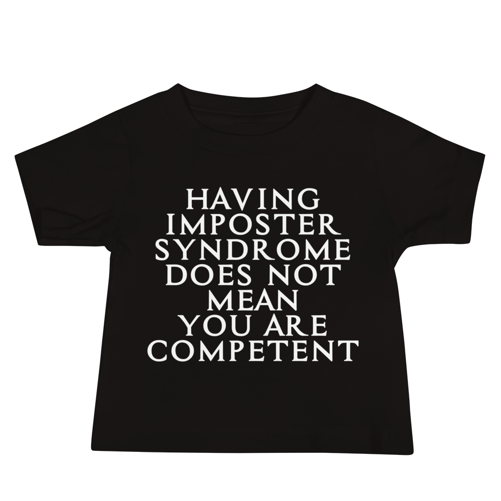 "Having Imposter Syndrome does not mean you are competent" printed on a black baby jersey short sleeve tee laying on a flat surface