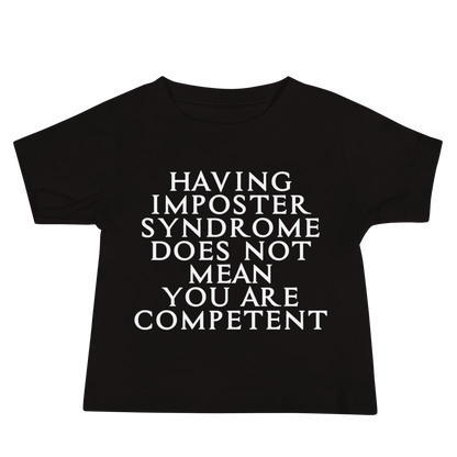 "Having Imposter Syndrome does not mean you are competent" printed on a black baby jersey short sleeve tee laying on a flat surface