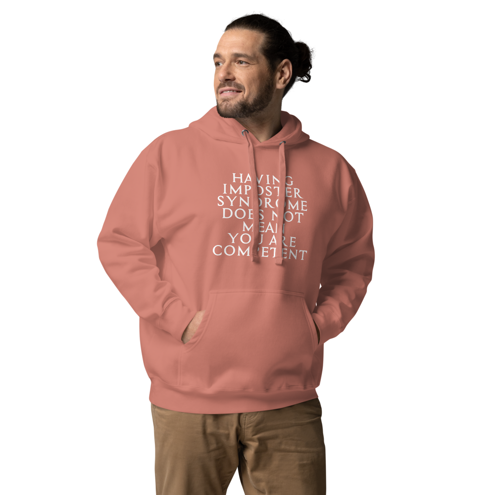 "Having Imposter Syndrome does not mean you are competent" printed on a dusty rose unisex hoodie worn by a male