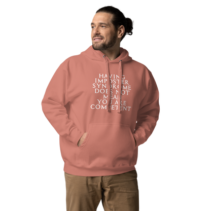 "Having Imposter Syndrome does not mean you are competent" printed on a dusty rose unisex hoodie worn by a male