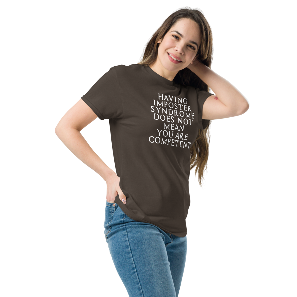 "Having Imposter Syndrome does not mean you are competent" printed on a dark chocolate unisex classic tee worn by a female