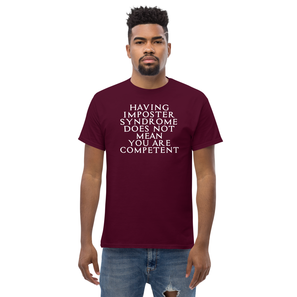 "Having Imposter Syndrome does not mean you are competent" printed on a maroon unisex classic tee worn by a male