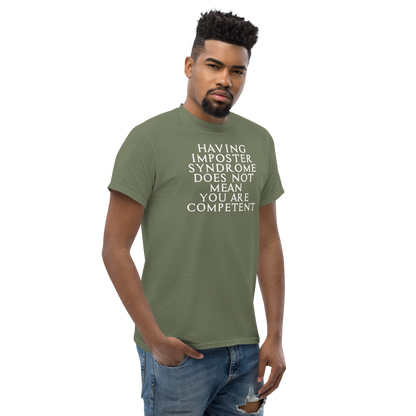 "Having Imposter Syndrome does not mean you are competent" printed on a military green unisex classic tee worn by a male