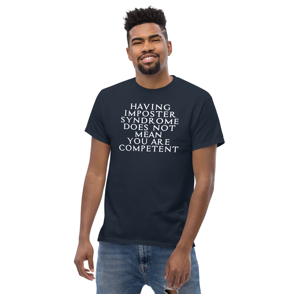"Having Imposter Syndrome does not mean you are competent" printed on a navy unisex classic tee worn by a male