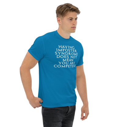 "Having Imposter Syndrome does not mean you are competent" printed on a sapphire unisex classic tee worn by a male