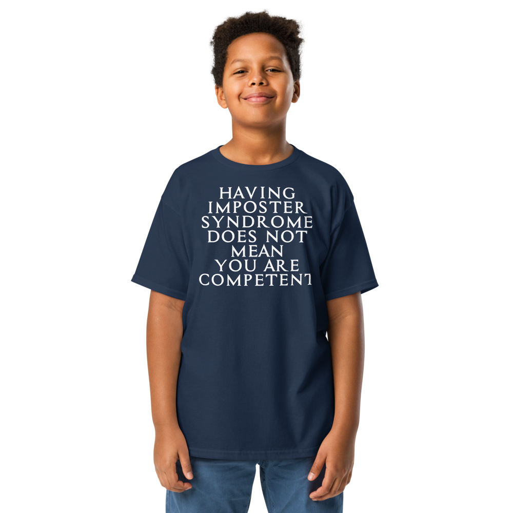 "Having Imposter Syndrome does not mean you are competent" printed on a navy youth classic tee worn by a male