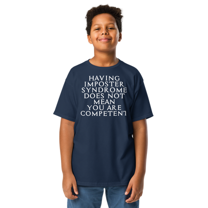 "Having Imposter Syndrome does not mean you are competent" printed on a navy youth classic tee worn by a male