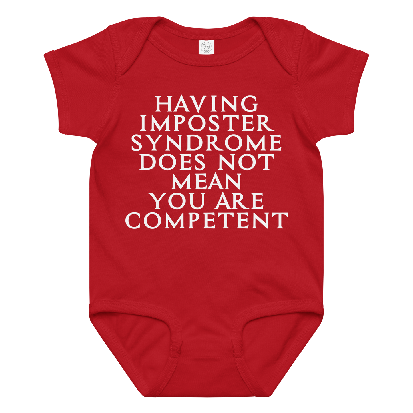 "Having Imposter Syndrome does not mean you are competent" printed on a red baby jersey bodysuit laying on a flat surface amongst other clothes