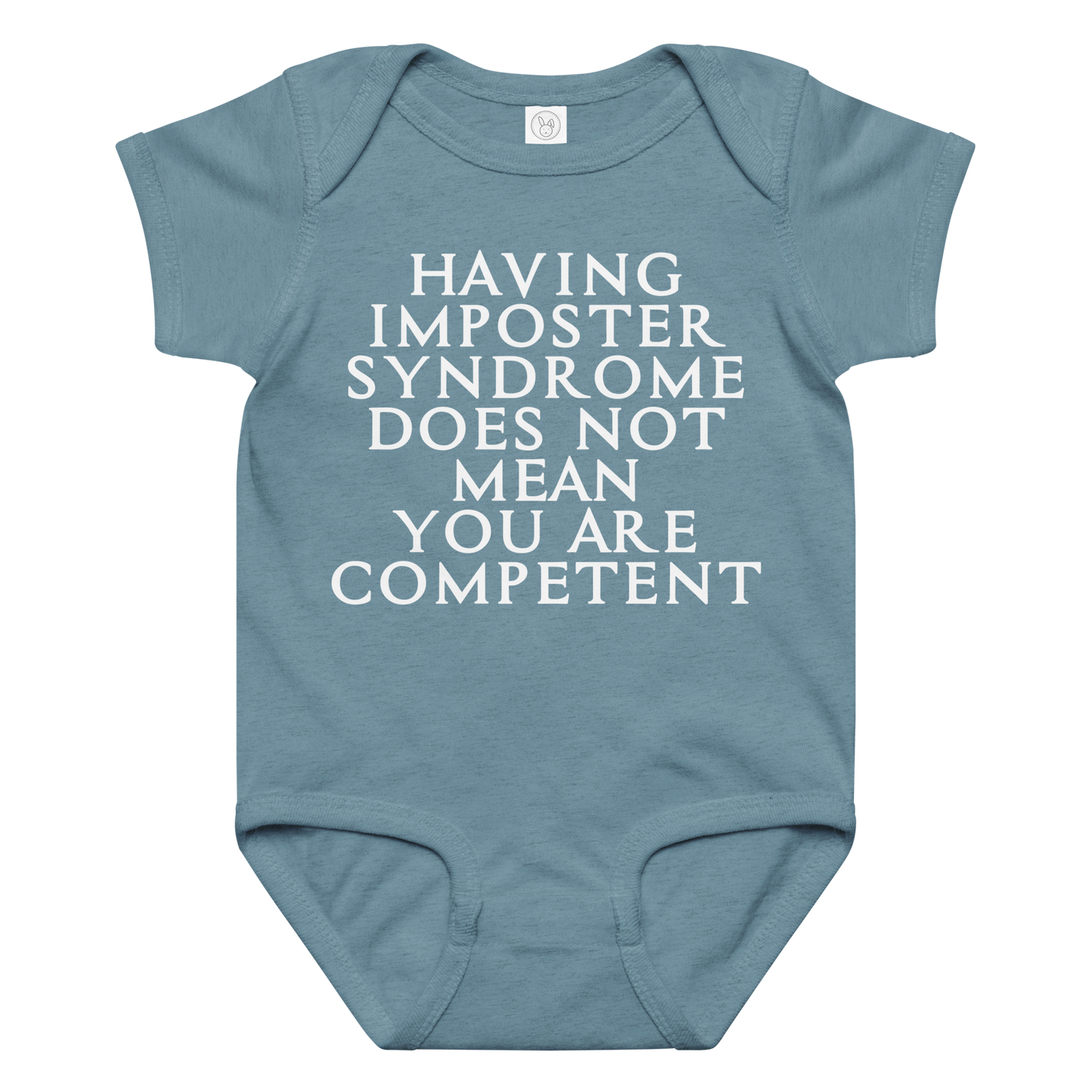 "Having Imposter Syndrome does not mean you are competent" printed on a vintage indigo baby jersey bodysuit laying on a flat surface amongst other clothes