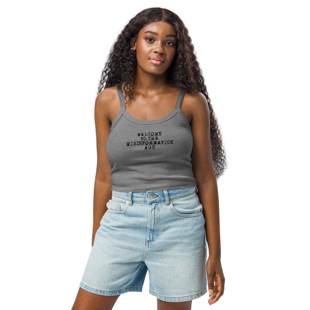 "Welcome to the misinformation age" printed on a athletic heather women's micro-rib tanktop worn by a female