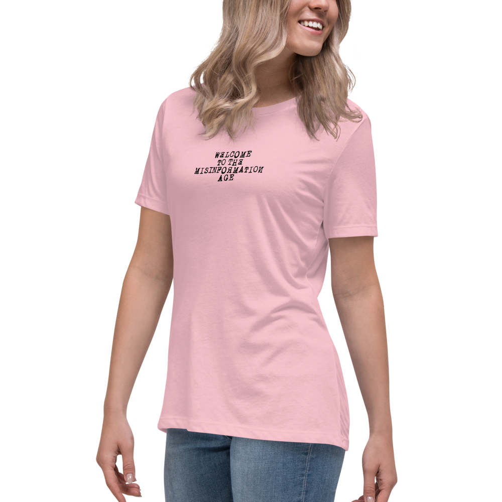 "Welcome to the misinformation age" printed on a pink women's relaxed t-shirt worn by a female