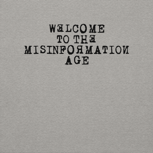 "Welcome to the misinformation age" printed on a carbon grey background
