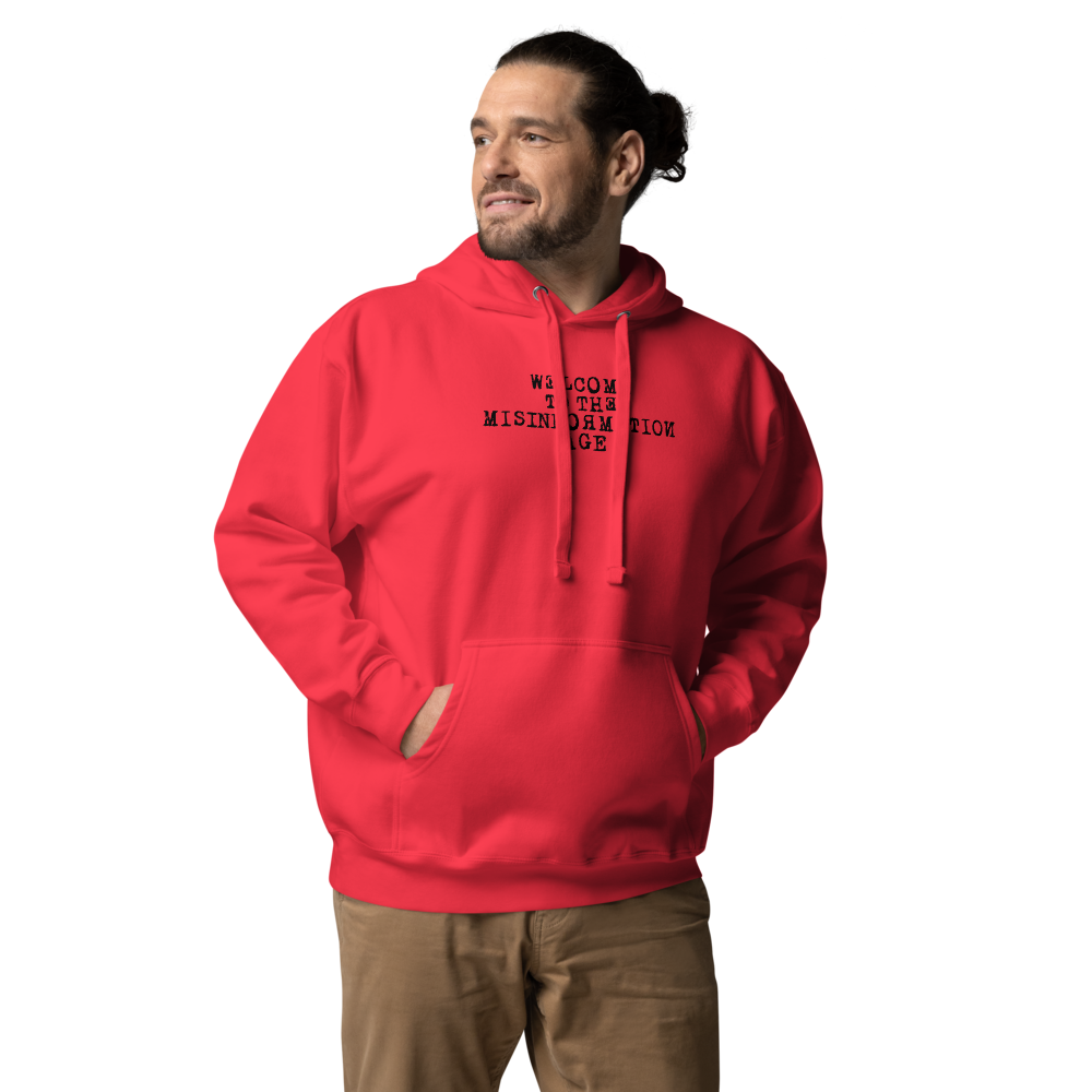 "Welcome to the misinformation age" printed on a team red unisex hoodie worn by a male