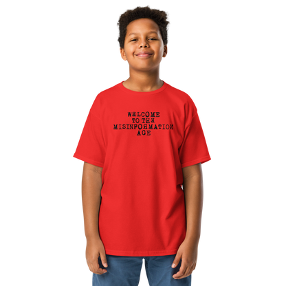 "Welcome to the misinformation age" printed on a red youth classic tee worn by a male