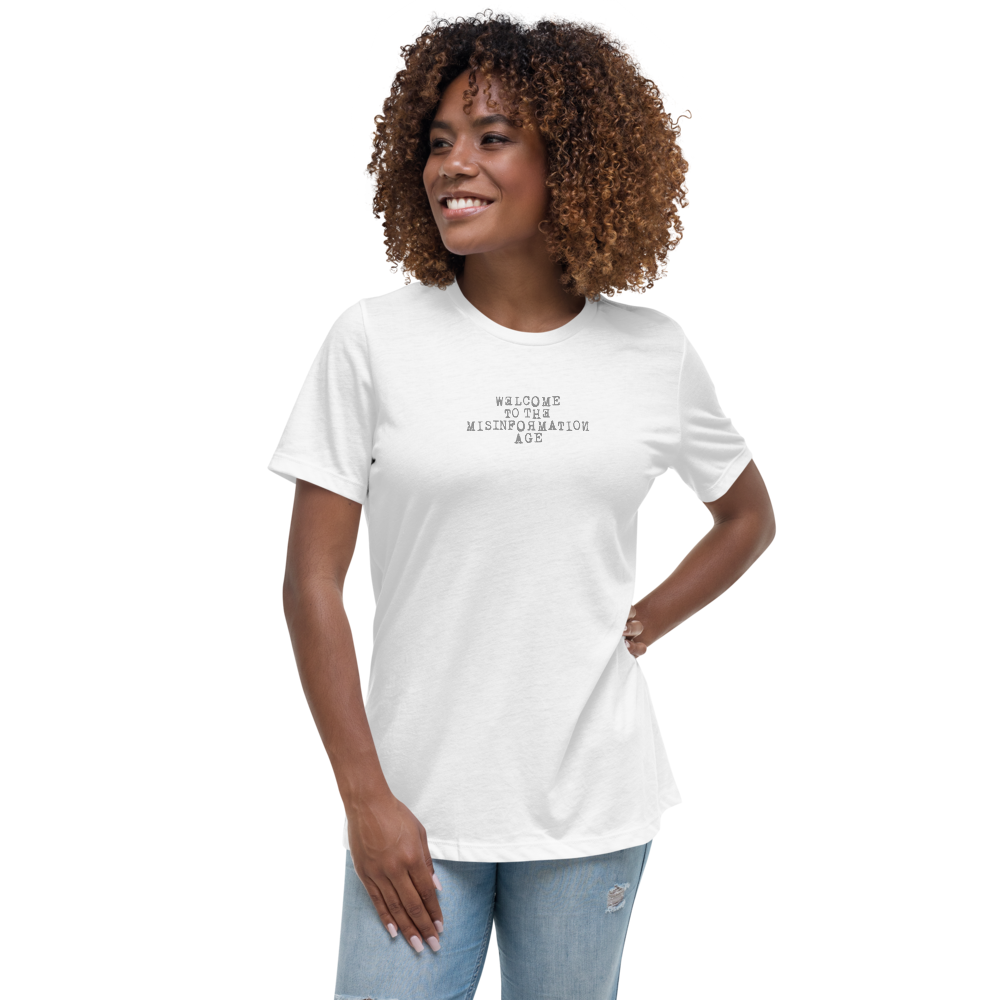 "Welcome to the misinformation age" printed on a white women's relaxed t-shirt worn by a female