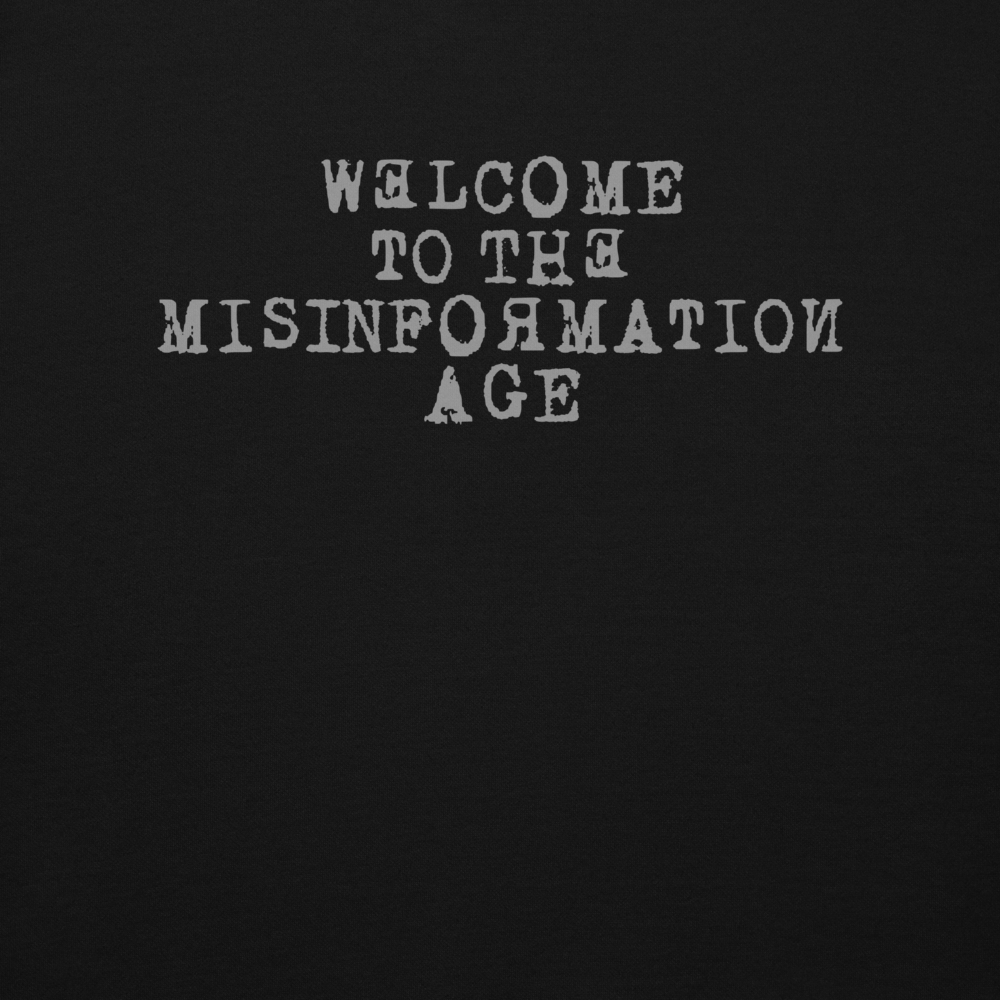 "Welcome to the misinformation age" printed on a black background