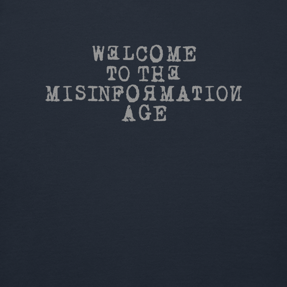"Welcome to the misinformation age" printed on a navy blazer background