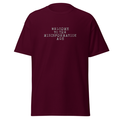 "Welcome to the misinformation age" printed on a maroon on an invisible body