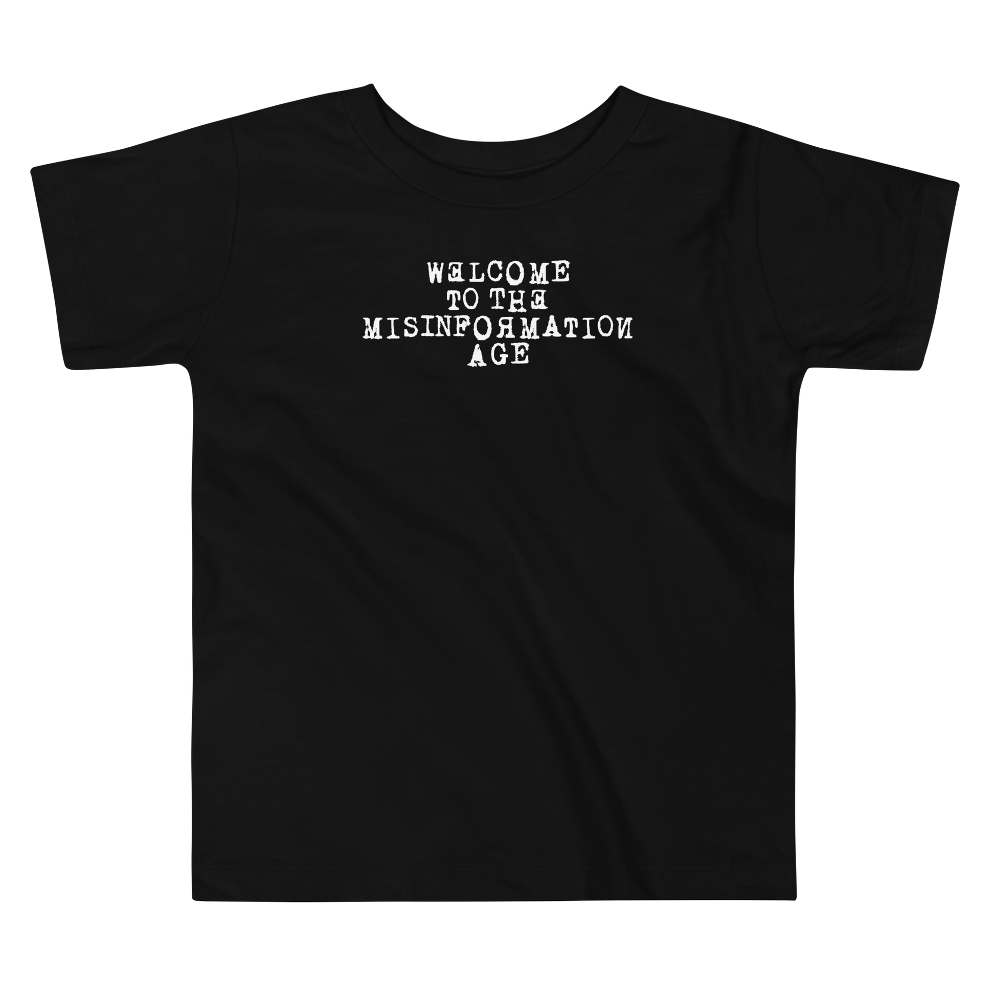 "Welcome to the misinformation age" printed on a black toddler short sleeve tee laying on a flat surface