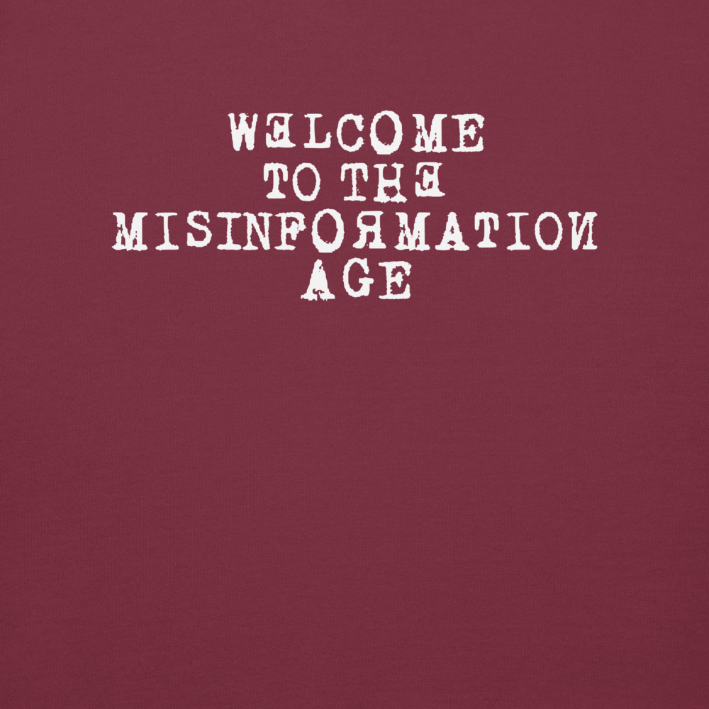 "Welcome to the misinformation age" printed on a maroon background