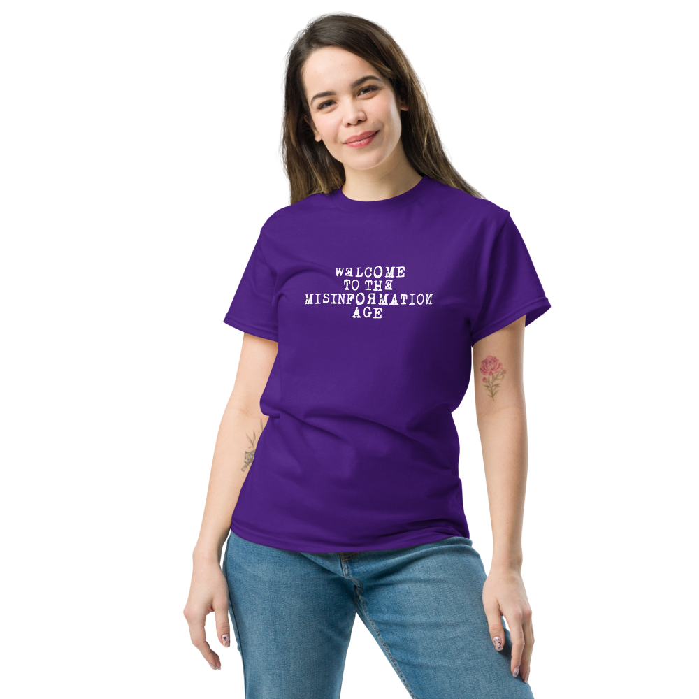 "Welcome to the misinformation age" printed on a purple unisex classic tee worn by a female