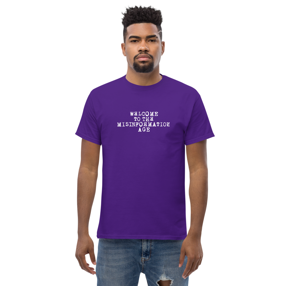 "Welcome to the misinformation age" printed on a purple unisex classic tee worn by a male