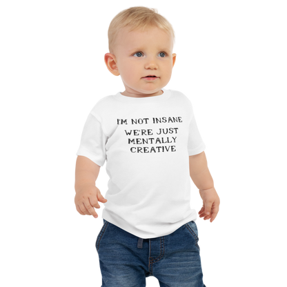 "I’m not insane   We’re just mentally creative" printed on a white baby jersey short sleeve tee worn by a male