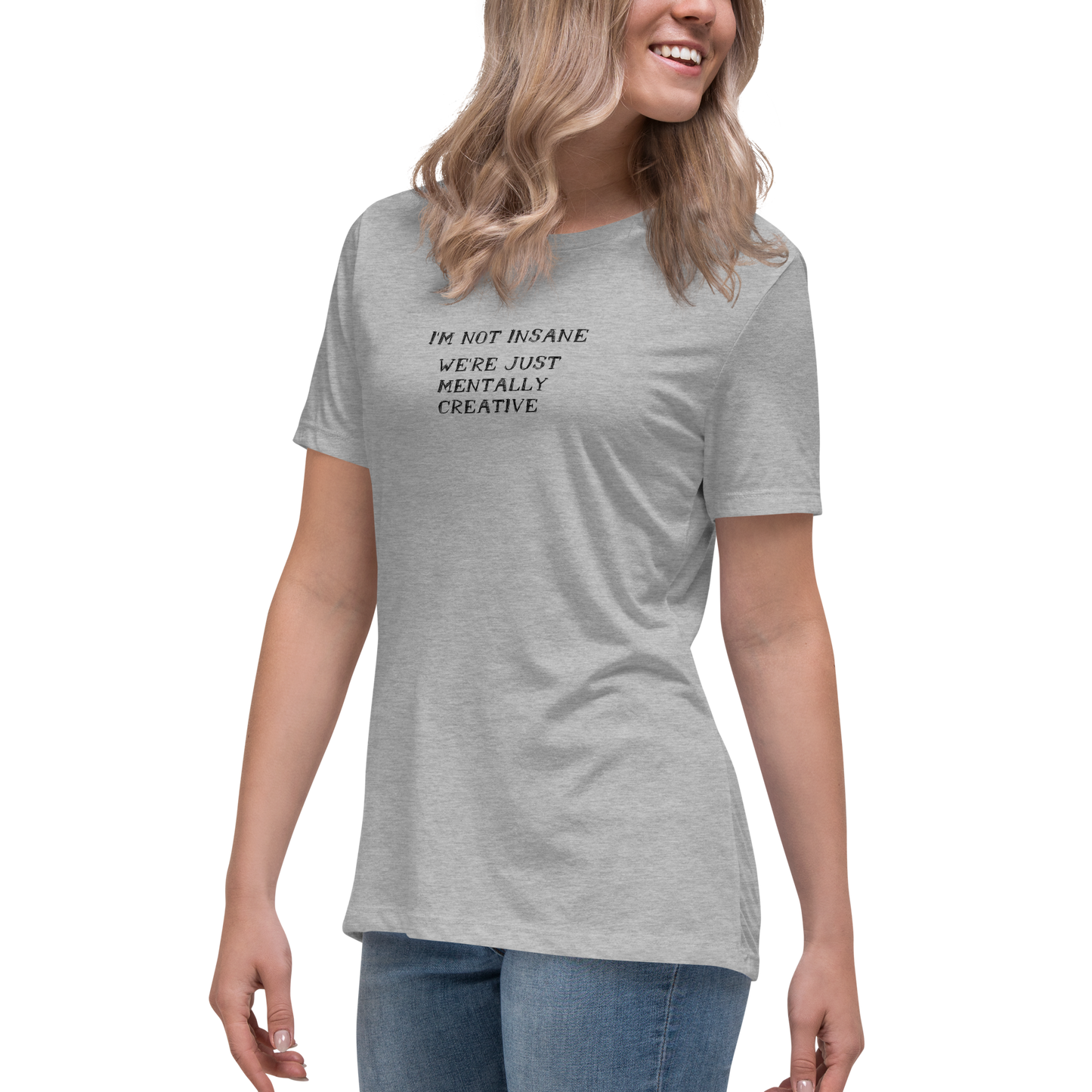 "I’m not insane   We’re just mentally creative" printed on a athletic heather women's relaxed t-shirt worn by a female