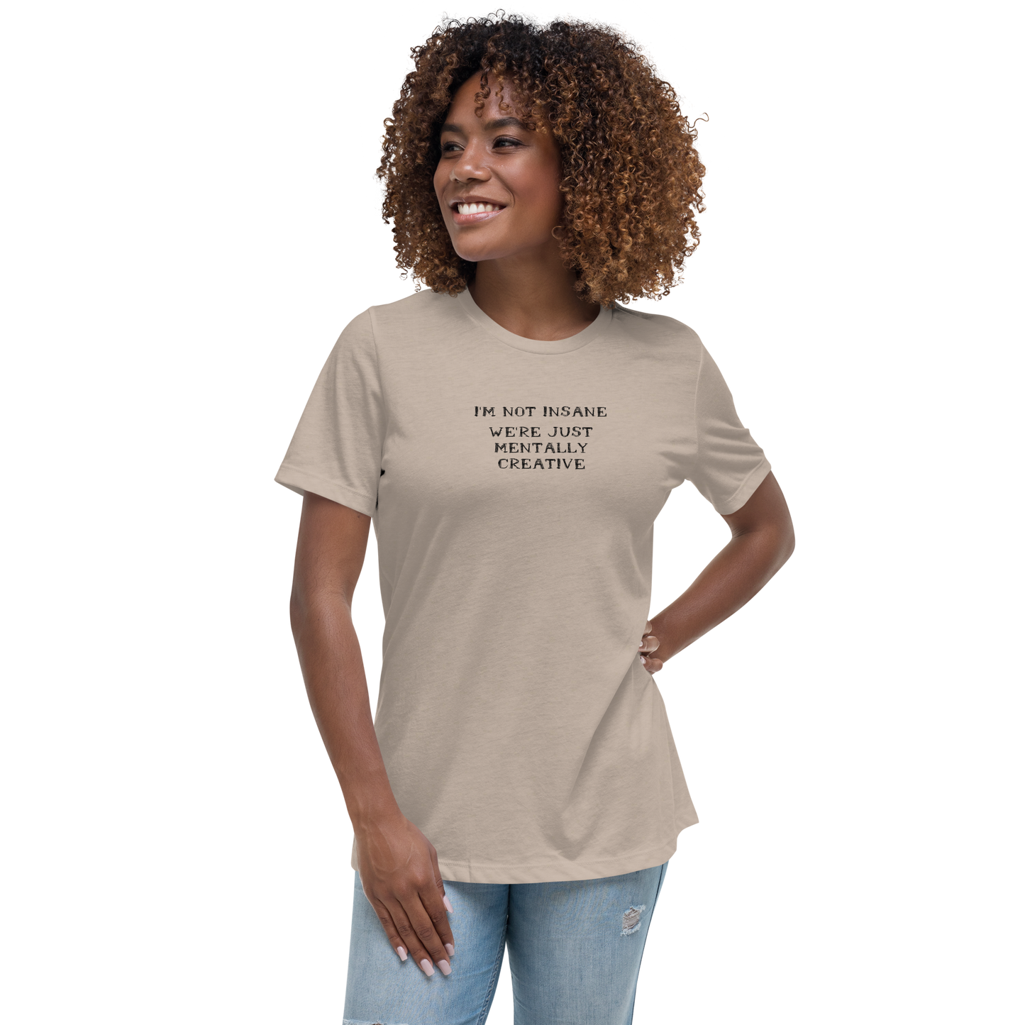 "I’m not insane   We’re just mentally creative" printed on a heather stone women's relaxed t-shirt worn by a female