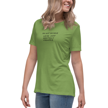 "I’m not insane   We’re just mentally creative" printed on a leaf women's relaxed t-shirt worn by a female