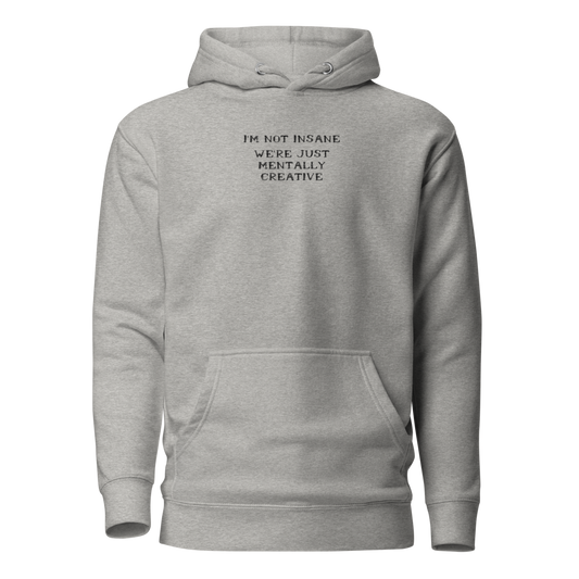 "I’m not insane   We’re just mentally creative" printed on a carbon grey on an invisible / simulated body