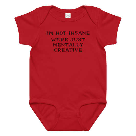 "I’m not insane   We’re just mentally creative" printed on a red baby jersey bodysuit laying on a flat surface amongst other clothes