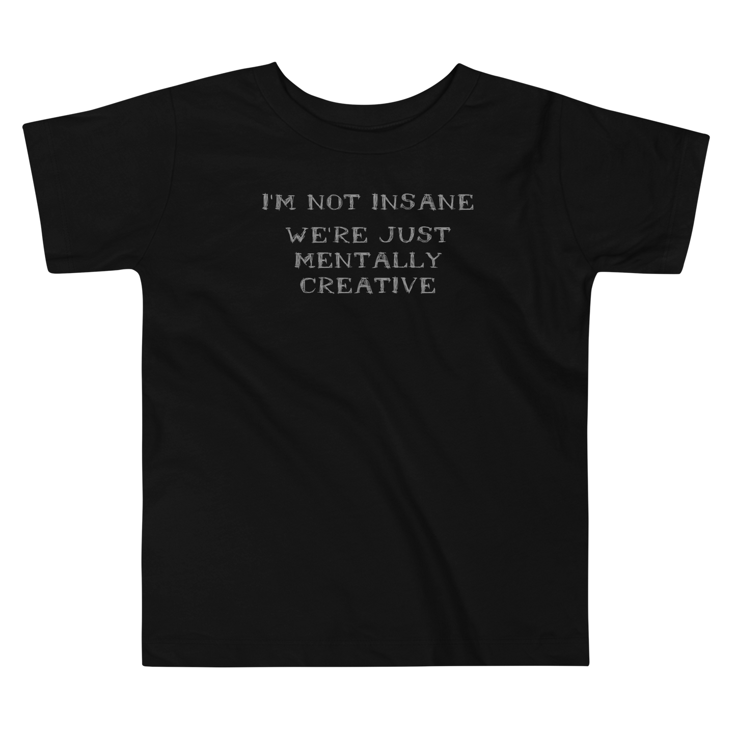 "I’m not insane   We’re just mentally creative" printed on a black toddler short sleeve tee laying on a flat surface