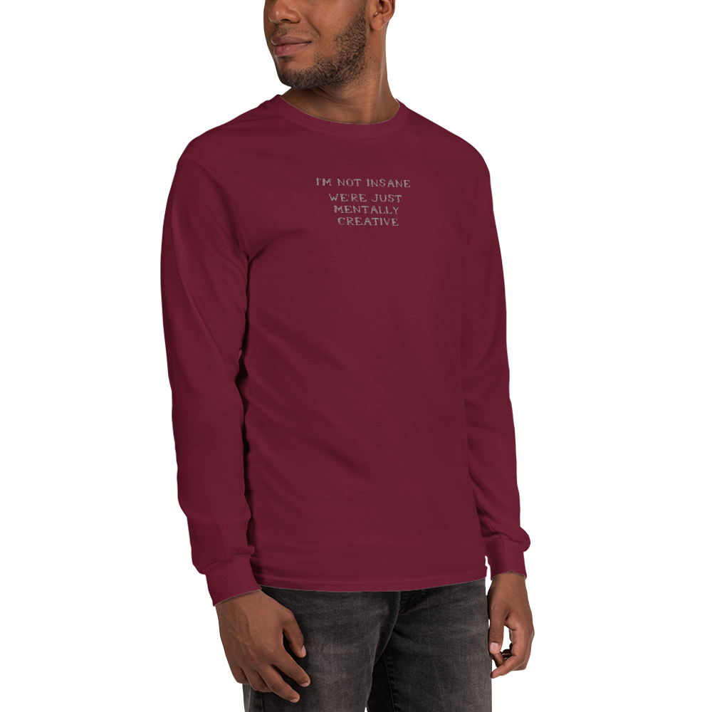 "I’m not insane   We’re just mentally creative" printed on a maroon men's long sleeve shirt worn by a male