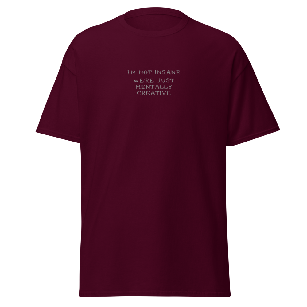 "I’m not insane   We’re just mentally creative" printed on a maroon on an invisible body