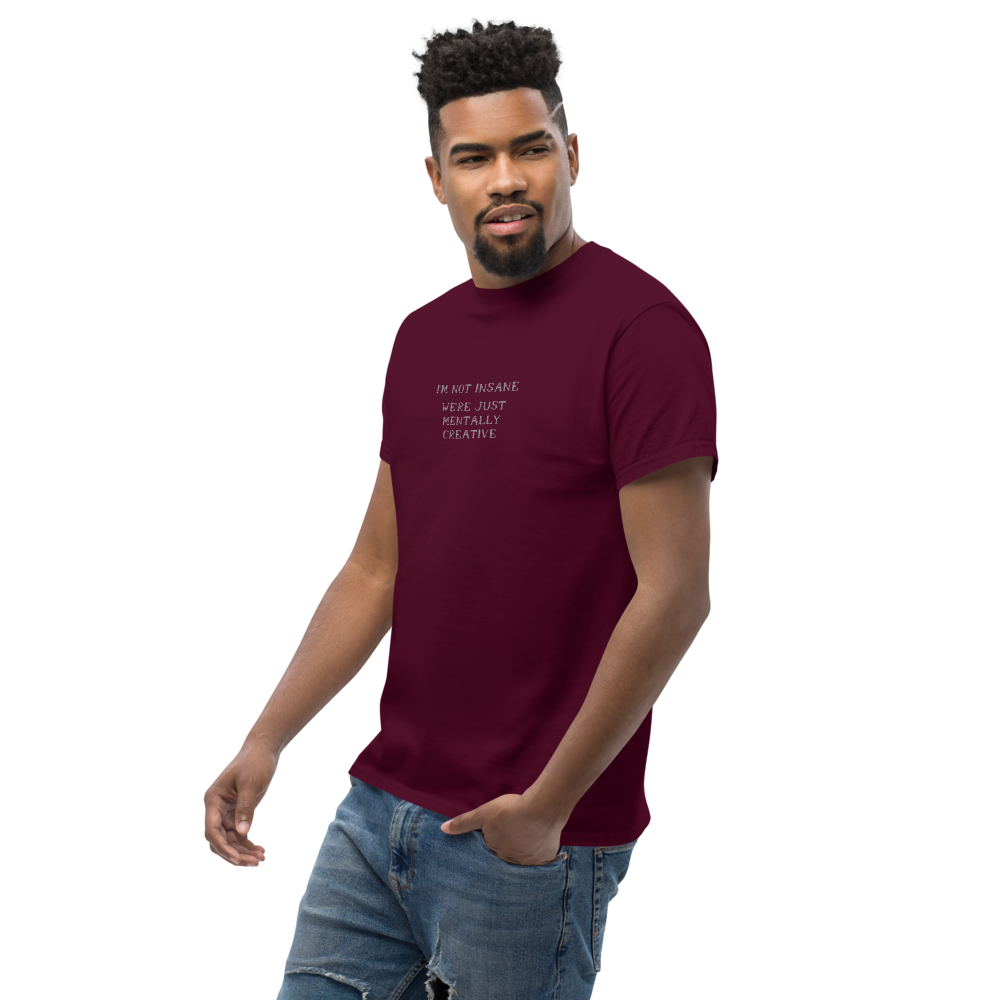 "I’m not insane   We’re just mentally creative" printed on a maroon unisex classic tee worn by a male