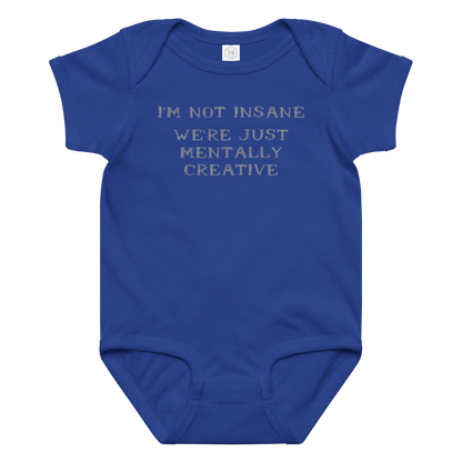 "I’m not insane   We’re just mentally creative" printed on a royal baby jersey bodysuit laying on a flat surface amongst other clothes