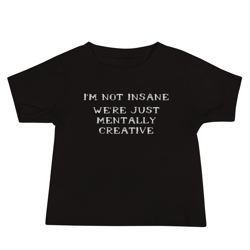 "I’m not insane   We’re just mentally creative" printed on a black baby jersey short sleeve tee laying on a flat surface