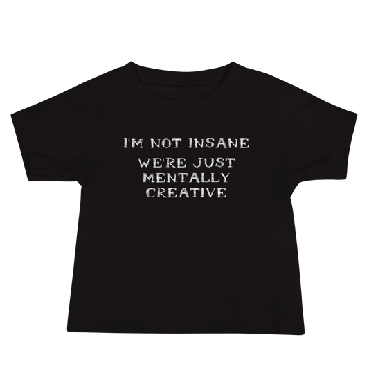 "I’m not insane   We’re just mentally creative" printed on a black baby jersey short sleeve tee laying on a flat surface