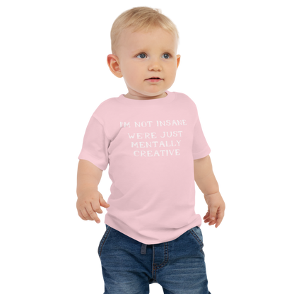 "I’m not insane   We’re just mentally creative" printed on a pink baby jersey short sleeve tee worn by a male