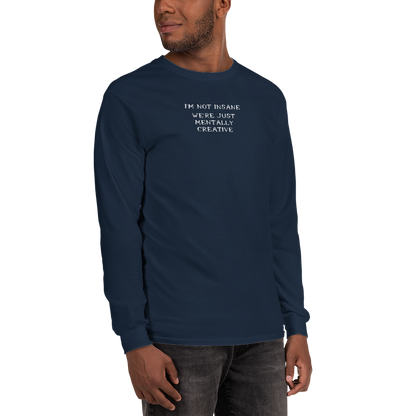 "I’m not insane   We’re just mentally creative" printed on a navy men's long sleeve shirt worn by a male