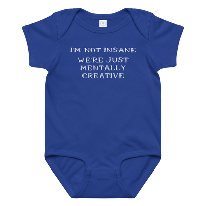 "I’m not insane   We’re just mentally creative" printed on a royal baby jersey bodysuit laying on a flat surface amongst other clothes
