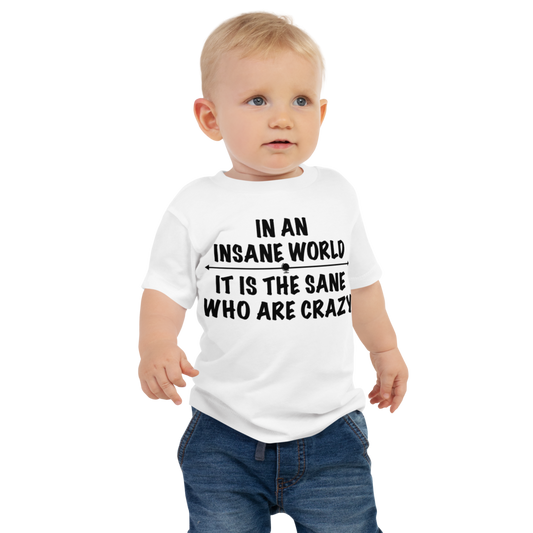 "In an insane world, it is the sane who are crazy" printed on a white baby jersey short sleeve tee worn by a male