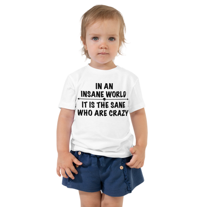 "In an insane world, it is the sane who are crazy" printed on a white toddler short sleeve tee worn by a female