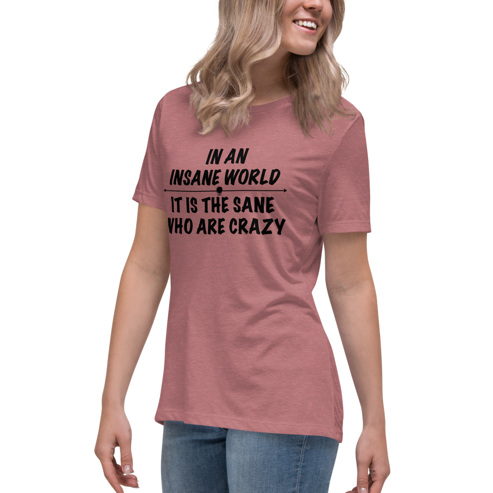 "In an insane world, it is the sane who are crazy" printed on a heather mauve women's relaxed t-shirt worn by a female
