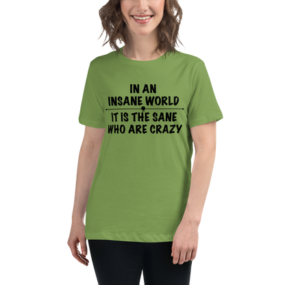 "In an insane world, it is the sane who are crazy" printed on a leaf women's relaxed t-shirt worn by a female